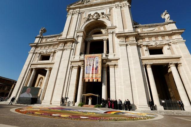 Pope Francis speaks outside Saint Mary of Angels Basilica in the pilgrimage town of Assisi